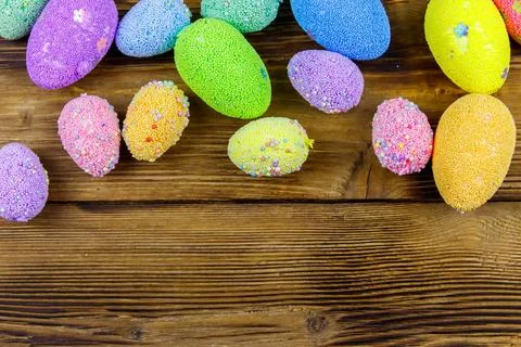 Easter eggs on rustic wooden background. Top view, copy space Stock Photos
