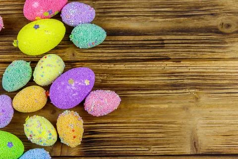 Easter eggs on rustic wooden background. Top view, copy space Stock Photos