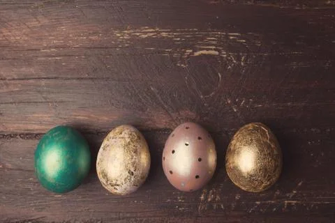 Easter eggs on rustic wooden table. Holiday background. Tinted p 库存照片
