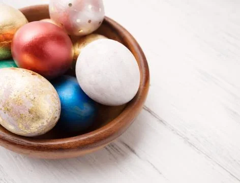 Easter eggs on rustic wooden table. Holiday background. Tinted p Stock Photos