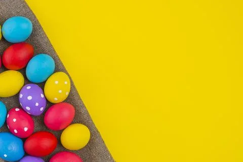 Easter eggs scattered canvas table Stock Photos