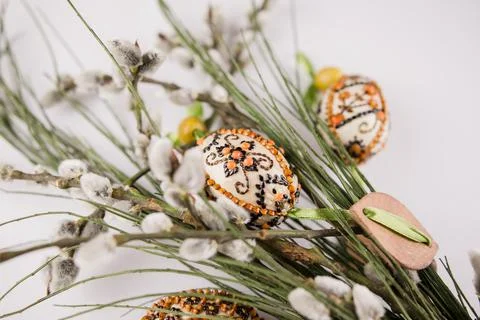 Easter eggs with a sprig on a white background Stock Photos