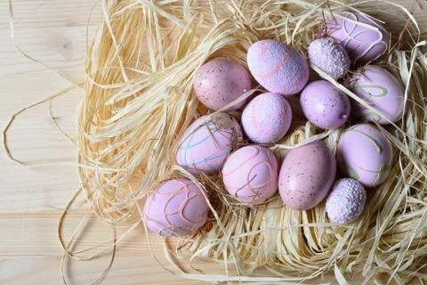 Easter eggs in a straw nest Stock Photos