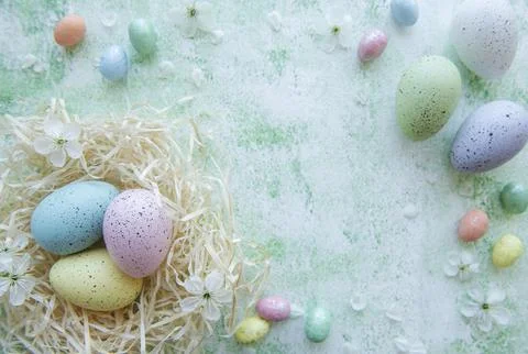 Easter eggs in straw nest Stock Photos