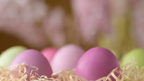Easter eggs in straw spin on blue background Stock Footage 148287344