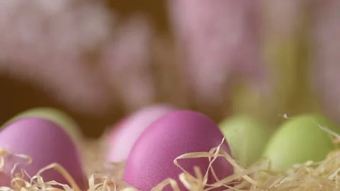 Easter eggs in straw spin on blue background Stock Footage 148287473