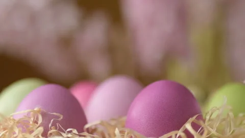 Easter eggs in straw spin on yellow background Stock Footage 148287494