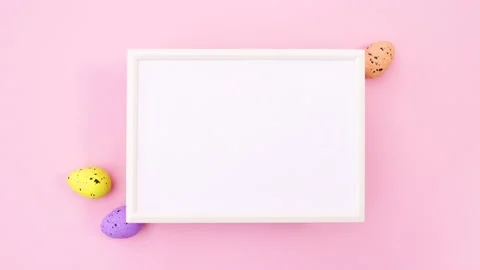 Easter eggs surround white frame for text. Stop motion 動画素材 147730608