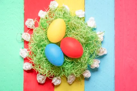 Easter eggs surrounded by roses Stock Photos