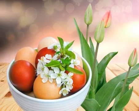 Easter eggs on the table in a ceramic vase. Stock Photos