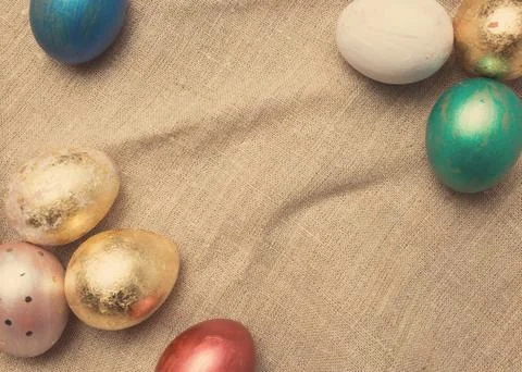 Easter eggs on table. Holiday background. Tinted photo. Stock Photos