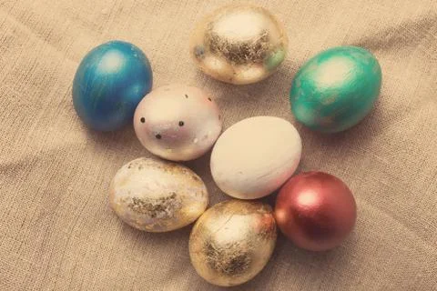 Easter eggs on table. Holiday background. Tinted photo. 库存照片