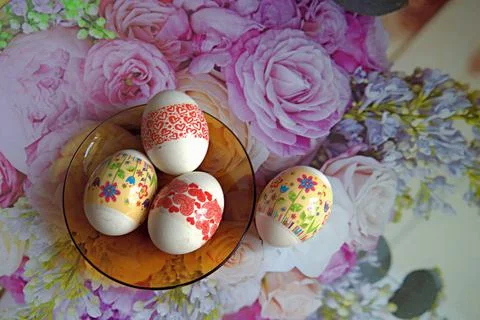 Easter eggs on a tablecloth painted with bright colors Stock Photos