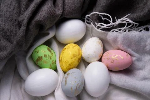 Easter eggs on a texture fabric. View from above. Easter eggs with place for Stock Photos