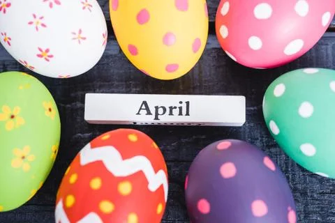 Easter eggs top view on black wooden background Stock Photos