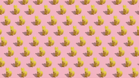 Easter Eggs Transforming into Bunnies Stop Motion Pink Background Video stock 330549332