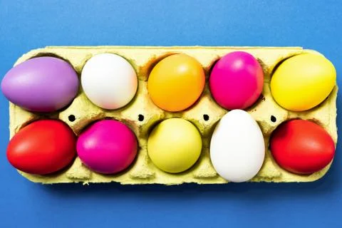 Easter eggs on a trendy blue background. Stock Photos