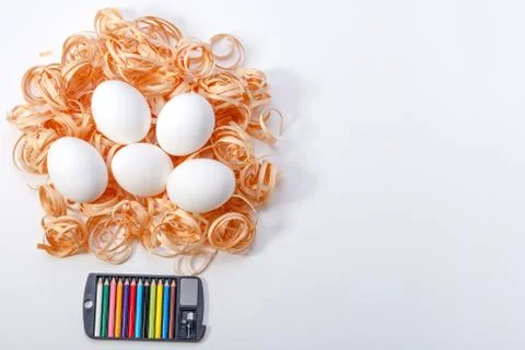 Easter eggs with twelve crayons Stock Photos