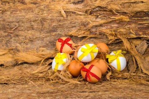 Easter eggs white and brown color with yellow and red  bows Stock Photos