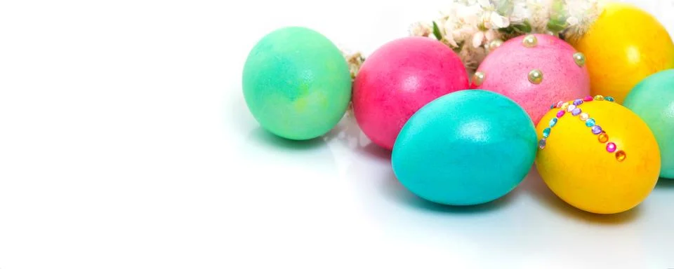 Easter eggs on white background close-up, banner Stock Photos