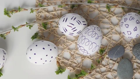 Easter eggs on a white background with flowers. Easter decor. white eggs with Stock Footage 108324606