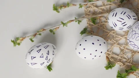 Easter eggs on a white background with flowers. Easter decor. white eggs with 스톡 동영상 108324753