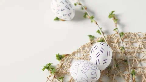 Easter eggs on a white background with flowers. Easter decor. white eggs with Stock-Footage 108325004