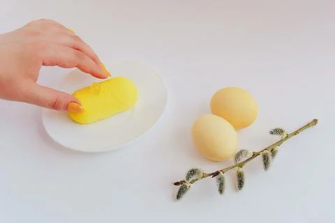 Easter eggs on a white background with a sprig of willow Stock Photos