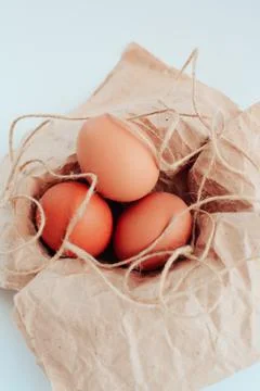 Easter eggs on a white background with a sprig of willow Foto stock