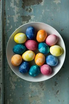 Easter eggs in white dish on light blue old concrete background 스톡 사진
