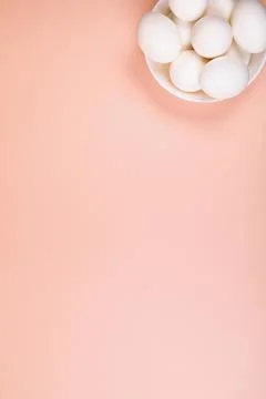Easter eggs white on a pink background with place for text. Stock Photos