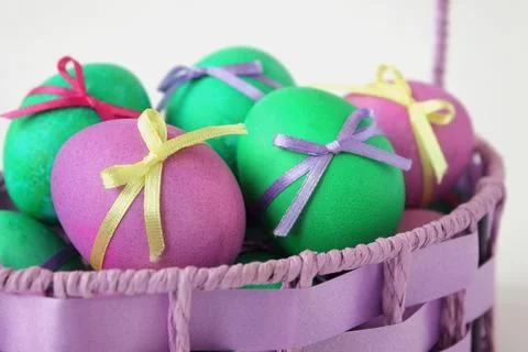 Easter eggs in wicker basket close up. Spring season. Family tradition. Stock Photos