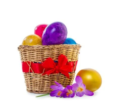 Easter eggs in a wicker basket Stock Photos