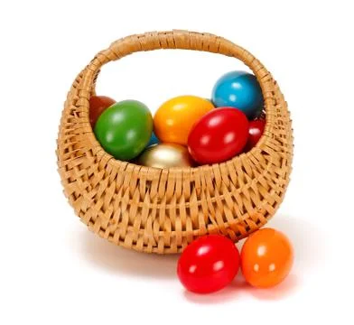 Easter eggs in wicker basket Stock Photos