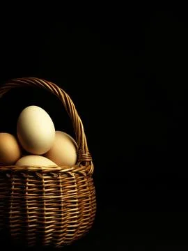Easter eggs in a wicker basket. Stock Photos