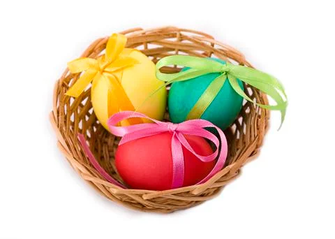 Easter eggs in a wicker basket Stock Photos