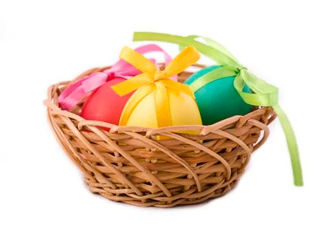 Easter eggs in a wicker basket Stock Photos