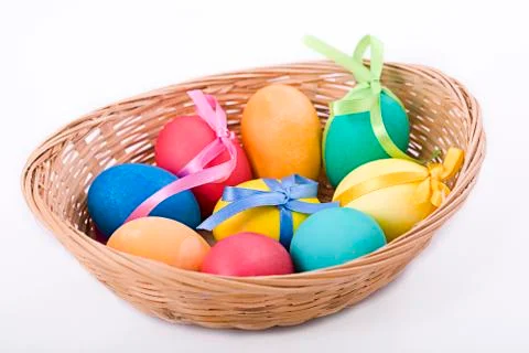 Easter eggs in a wicker basket Stock Photos
