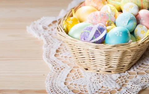 Easter eggs in  wicker basket Stock Photos