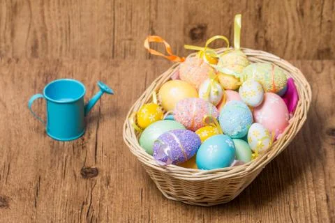 Easter eggs in  wicker basket Stock Photos