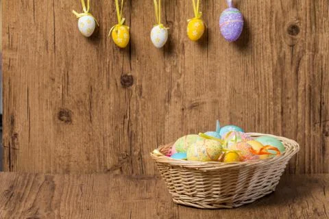 Easter eggs in  wicker basket Stock Photos