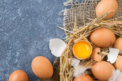 Easter eggs  in a Wicker basket with straw Stock Photos
