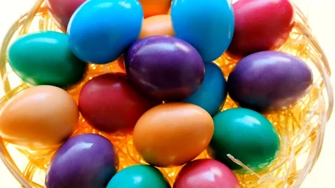 Easter eggs in a wicker bowl on a white background.Spring religious holiday Stock Footage 227343737