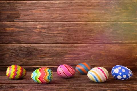 Easter eggs on wooden background. 3D rendering illustration. Stock Illustration