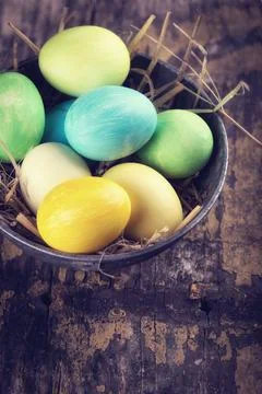Easter eggs on wooden background. Easter background for design. Retro style.. Stock Photos
