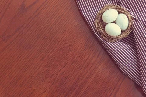 Easter eggs on wooden board, easter holiday concept. Copyspace for text. Stock Photos
