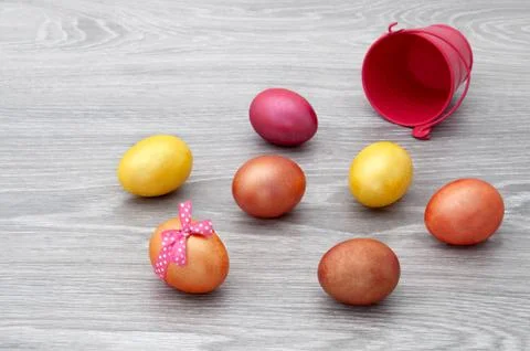 Easter eggs on a wooden gray table. Greeting card with Easter. Stock Photos