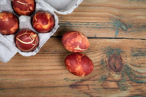 Easter Eggs on Wooden Texture Table. Cardboard Packaging Stock Photos