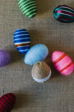 Easter eggs wrapped in string Stock Photos