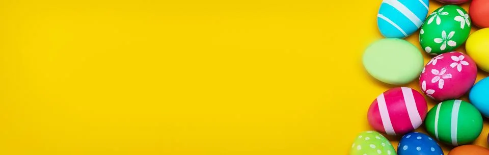 Easter eggs on yellow background Stock Photos